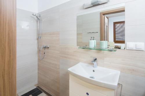 a bathroom with a sink and a shower at Ubytovanie Zuzana in Liptovská Teplá