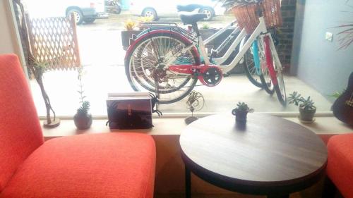 a room with a bike parked next to a table at ChingTing B&B in Chishang