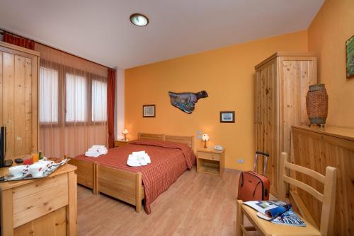 En eller flere senger på et rom på Hotel Halimeda