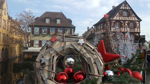 a christmas display in front of a house at Fleur de Vigne in Eguisheim