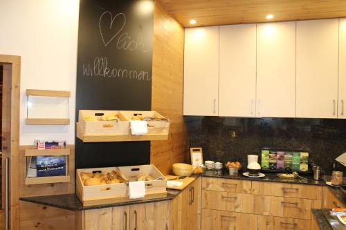 a kitchen with boxes of bread on a counter at Gastwirtschaft Hold in Mönichwald