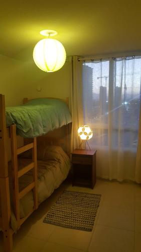 1 dormitorio con litera y luz en Dpto Marina Oceano, en Coquimbo