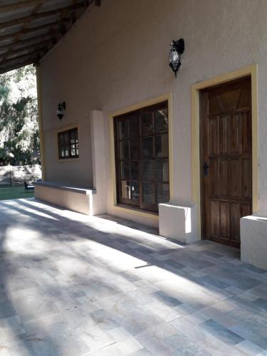 a building with two doors and a patio at Cabañas de Bella Vista in Bella Vista