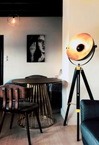 a saxophone on a tripod next to a table at Rocks Republic in Kalabaka