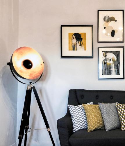 a large instrument on a tripod next to a couch at Rocks Republic in Kalabaka