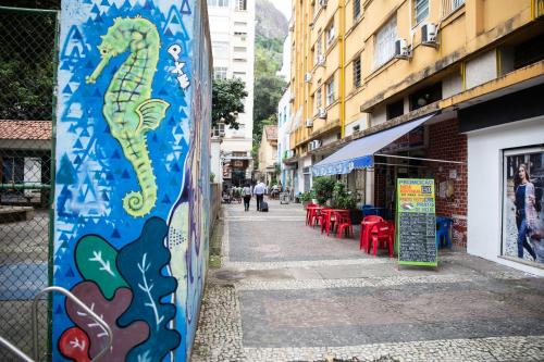 a wall with a seahorse painted on it on a street at Solar Hostel Beach Copacabana in Rio de Janeiro
