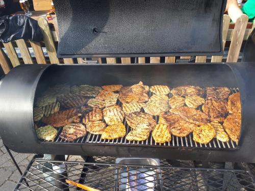 a bunch of food cooking on a grill at Hotel Bigger Hof - Wirtshaus Platzhirsch am Jahnplatz in Olsberg
