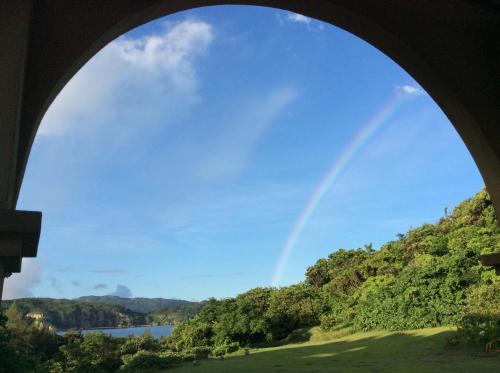 a view of a rainbow from a bridge at Mayagusuku Resort in Iriomote