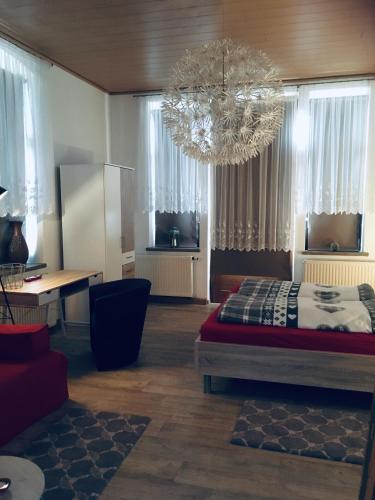 Ένα ή περισσότερα κρεβάτια σε δωμάτιο στο Turmvilla Vogtland