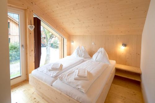 Кровать или кровати в номере Aron Chalet Kreischberg 10A