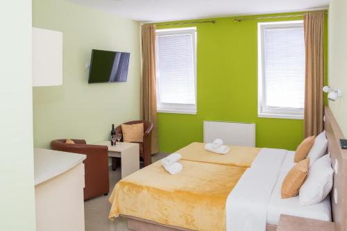 Ένα ή περισσότερα κρεβάτια σε δωμάτιο στο SAN 011