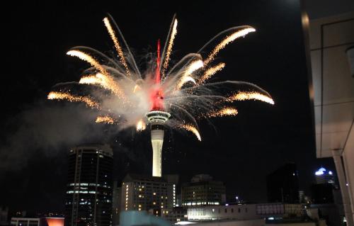 a fireworks display at the top of the cn tower at Downtown Townhouse Special in Auckland