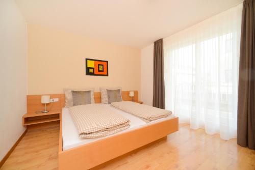 Una cama o camas en una habitación de Kronsun Percha