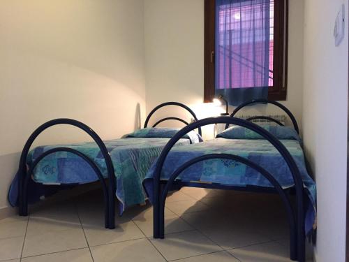 Posteľ alebo postele v izbe v ubytovaní Holiday home in Rosolina Mare 26701