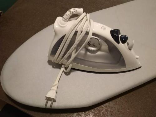 a white hair dryer sitting on top of a table at Hotel Sunset Terrace in Chatan