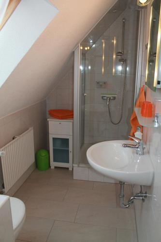 a bathroom with a sink and a shower at Ostseehaus Prerow in Prerow