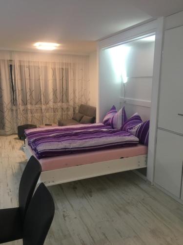 Кровать или кровати в номере Holiday 87