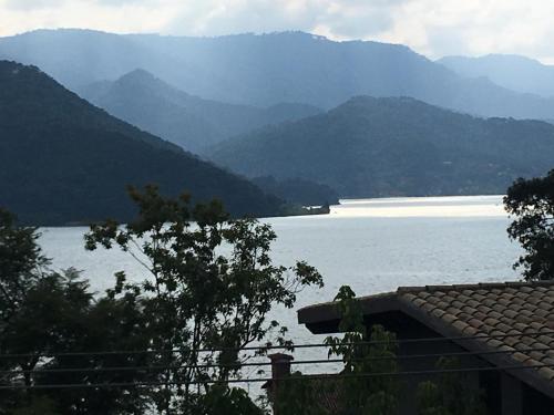 a view of a large body of water with mountains at Casa Cielo in Valle de Bravo