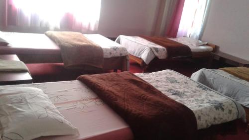מיטה או מיטות בחדר ב-Lampokhari Village Resort - Aritar