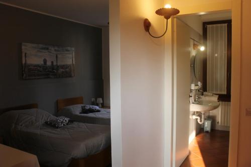 Posteľ alebo postele v izbe v ubytovaní ALBERGO LA SCALETTA