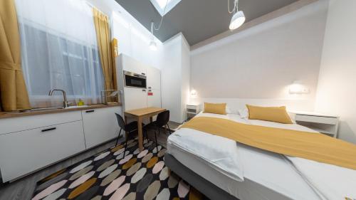 A bed or beds in a room at BpR Downtown Gemstone Apartments