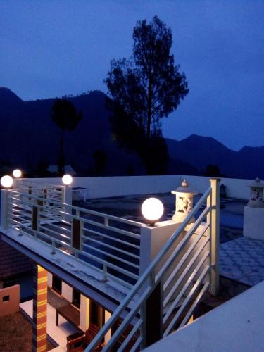 a house with lights on the roof at night at Bromo Otix Guest House in Bromo