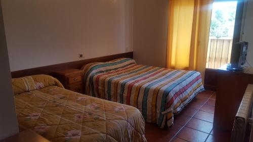 Uma cama ou camas num quarto em HOSPEDAJE CASA MARIANO