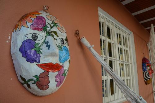 a painting of a face on the side of a building at Serrambi Praia Suites in Porto De Galinhas