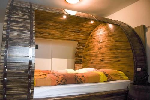 a bedroom with a large mirror and a bed at Apartments FABRKA in Ljubljana