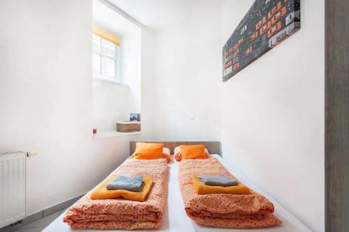 a room with two beds sitting on a table at Apartments FABRKA in Ljubljana