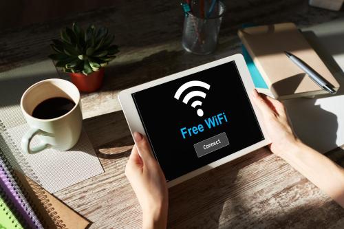 a person holding a tablet computer with a fire wifi at Hotel Königsteiner Hof in Königstein in der Oberpfalz