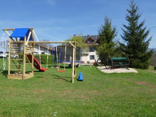 a group of playground equipment in a park at Ubytování Farma U sv. Jakuba in Dolní Lánov