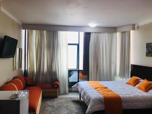 Postel nebo postele na pokoji v ubytování Sol Del Sur Hotel