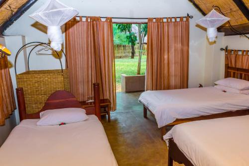 Katil atau katil-katil dalam bilik di The Royal Sichango Village