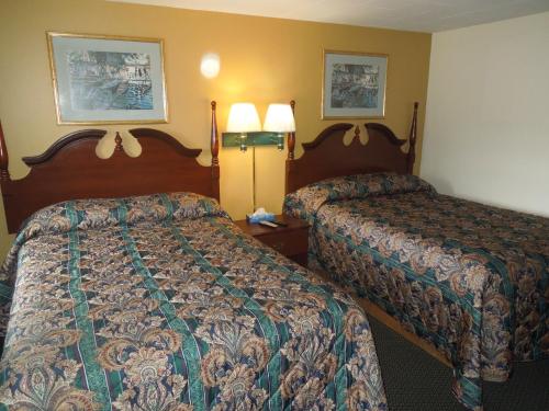 Ένα ή περισσότερα κρεβάτια σε δωμάτιο στο Budget Inn Watkins Glen