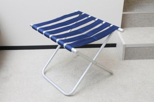 a blue beach chair sitting in a room at Center Hotel Tokyo in Tokyo