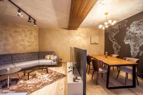 a living room with a couch and a table at Bella Roe Premium Apartments in Belgrade