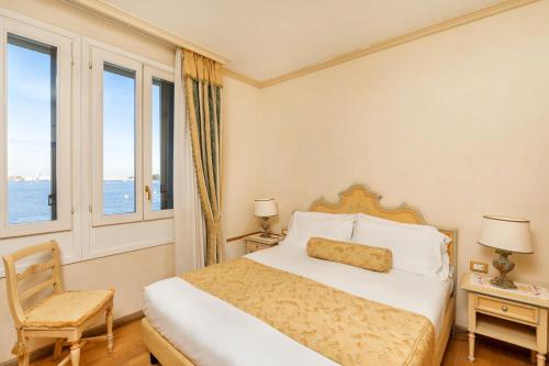 Posteľ alebo postele v izbe v ubytovaní Hotel Villa Laguna