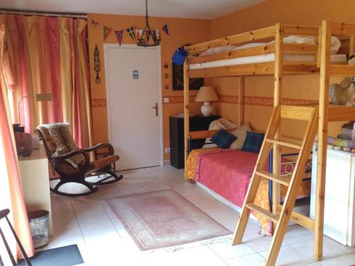 a bedroom with a bunk bed and a chair at Le Relais de Montchat in Lyon