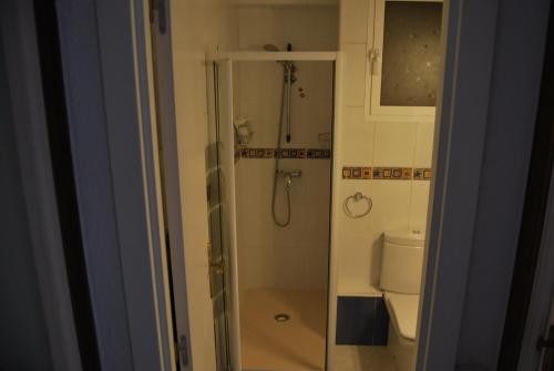 a bathroom with a shower and a toilet at Atico Nacho in Torremolinos