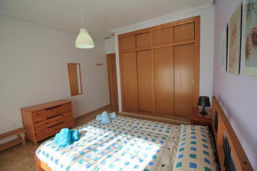 Ένα ή περισσότερα κρεβάτια σε δωμάτιο στο Apartamento BENIMUR 3