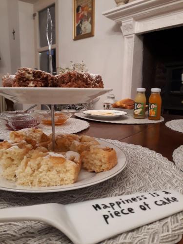 a table with a plate of pastries on a table at Garda Relais Antica Romelia in Montichiari