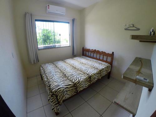En eller flere senger på et rom på Casa em Bombinhas