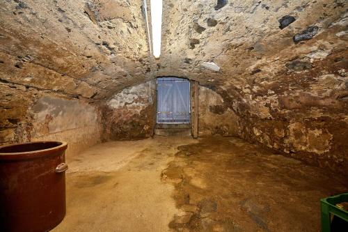 a dark room with a window in a stone wall at Ferienhaus Casa Maria in Morbach