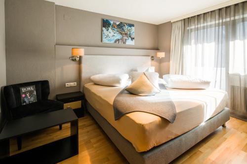 Hotel Gipfelherz Ischglにあるベッド