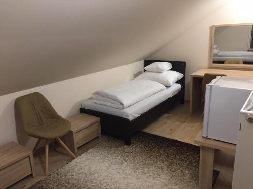 Voodi või voodid majutusasutuse MOKKA PANZIÓ toas