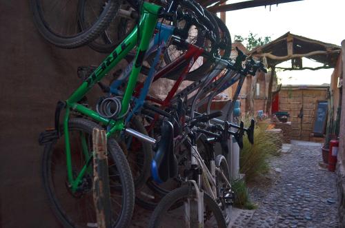 a group of bikes are lined up against a wall at Ckuri Atacama in San Pedro de Atacama