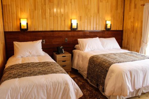 Postel nebo postele na pokoji v ubytování Hotel Aliwen