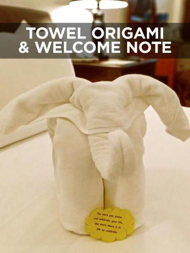 a towel elephant and welcome note on a stuffed animal at Areca Hotel Penang in George Town