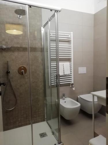 a bathroom with a shower and a toilet and a sink at Locanda degli Ulivi in Arcugnano